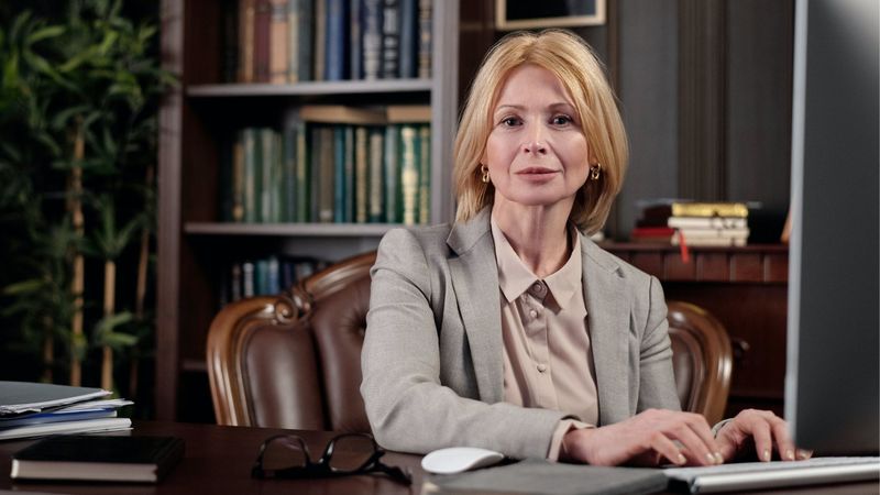 A professional solicitor sitting in her office