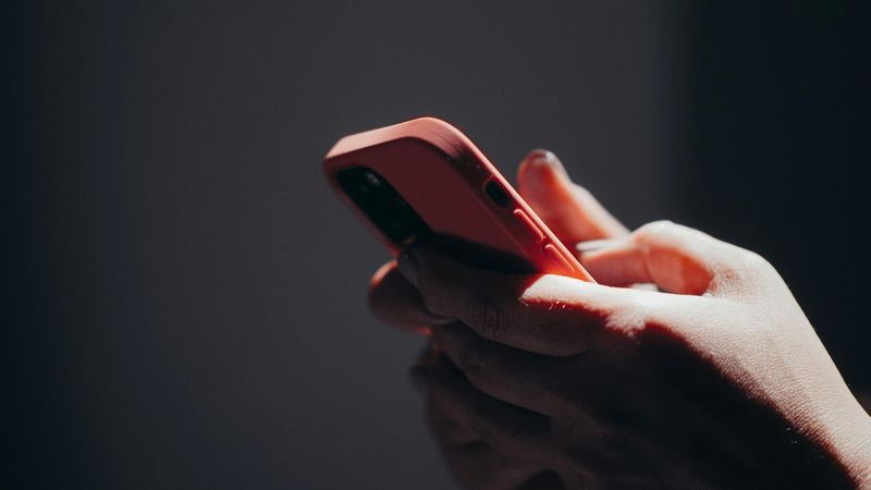 A girl reading social media news on her phone